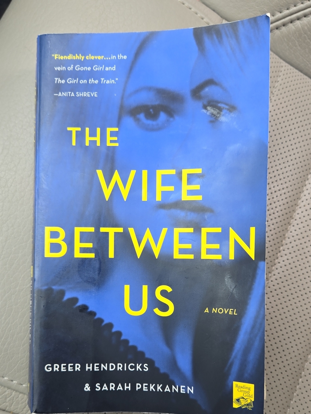 The Wife Between Us by Greer Hendricks & Sarah Pekkanen - Blue & Yellow Cover